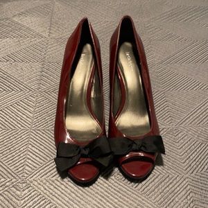 Maroon patent leather peep toe pumps